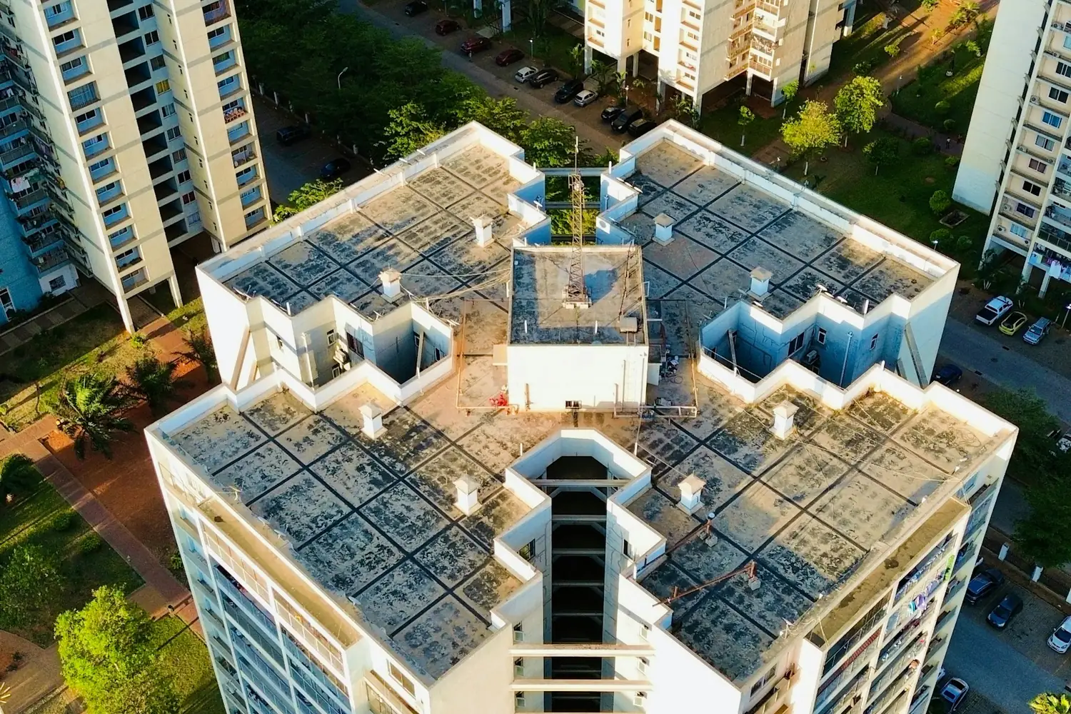 Aerial view of an apartment development and surrounding buildings